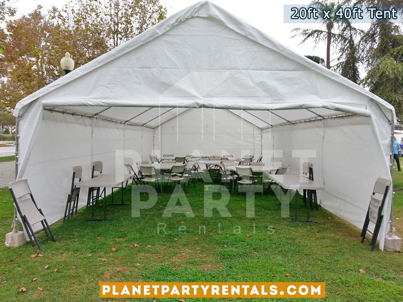 20x40 White Party Tent on grass with 60" Rectangular Tables and White Plastic Chairs