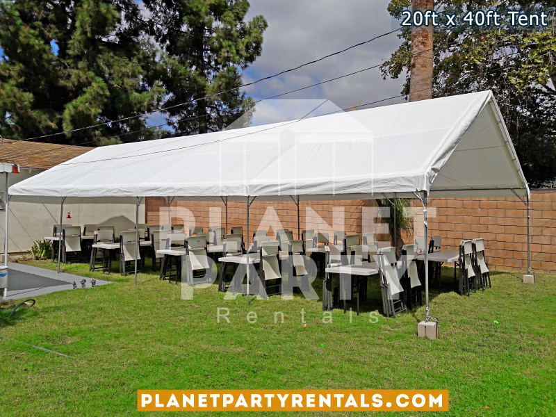 20x40 White Party Tent on grass with 60" Rectangular Tables and White Plastic Chairs