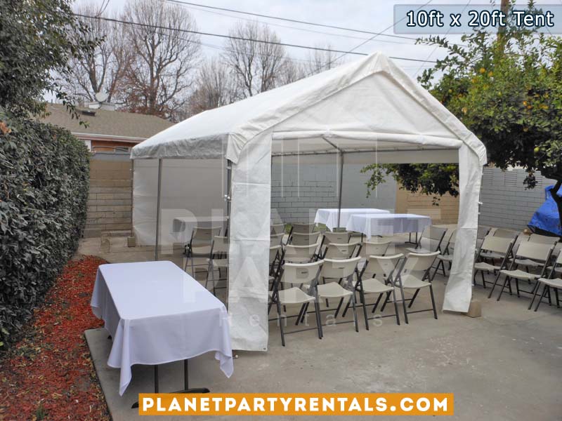 10x20 White Party Tent with white Sidepanels and Plastic White Chairs setup on cement